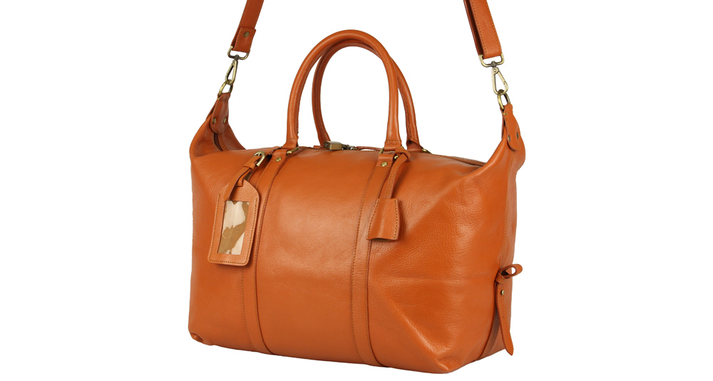 оранжевая кожаная сумка для переездов и путешествий